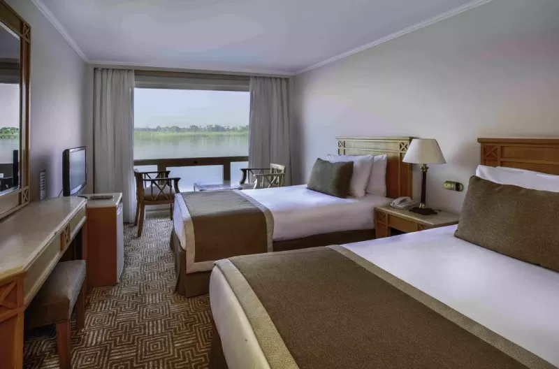 Stateroom aboard Iberotel Crown Emperor Nile Cruise with panoramic river view